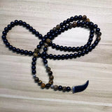 collier homme protection