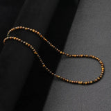 collier perle homme ras du cou​