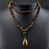 collier oeil de tigre breloque