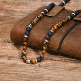 collier pierre oeil de tigre homme