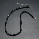 collier perles noires homme​