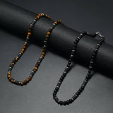 collier homme perle noir​